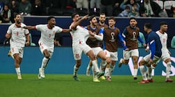 Nizar Al Rashdan, centre, celebrates with teammates after scoring against Saudi Arabia in the Arab Cup semi-final. AFP
