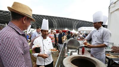 People trying food at different restaurant in the Taste of Abu Dhabi held at Du Arena at Yas Island in Abu Dhabi in 2014. Pawan Singh / The National
