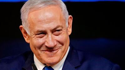 Israeli Prime Minister Benjamin Netanyahu smiles as he addresses supporters at his Likud Party headquarters in Tel Aviv on election night early on April 10, 2019. AFP