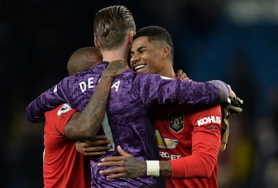 epa08052987 Manchester United's Marcus Rashford (R) and David de Gea (C) react after the English Premier League soccer match between Manchester United and Manchester City held at the Etihad Stadium, Manchester, Britain 07 December 2019. EPA/PETER POWELL EDITORIAL USE ONLY. No use with unauthorized audio, video, data, fixture lists, club/league logos or 'live' services. Online in-match use limited to 120 images, no video emulation. No use in betting, games or single club/league/player publications