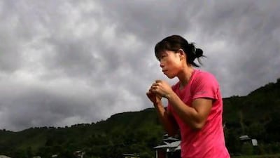 Mary Kom, a five-time world champion, practices boxing at her residence in Langol Games village on the outskirts of Imphal.