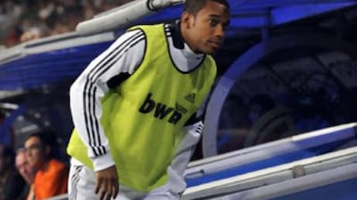 Robinho of Real Madrid takes his place on the substitutes bench before the start of the Super Copa second leg match between Real Madrid and Valencia at the Santiago Bernabeu stadium on August 24, 2008 in Madrid, Spain.
