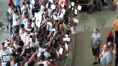 Drivers and hotel greeters awaiting incoming guests at Ngurah Rai Airport in Bali. With tourism on the rise, Talixo is seeing opportunity to expand. Getty