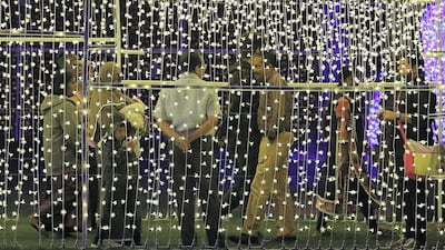 People at the Palm Oasis near Al Noor Masjid during the Sharjah Light Festival in Sharjah. Pawan Singh / The National