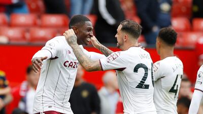Aston Villa's Kortney Hause celebrates with Danny Ings after the match. Reuters