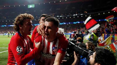 Jose Gimenez celebrates with teammates after scoring the opening goal. Reuters