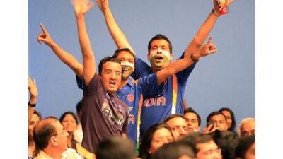 Indian cricket team supporters show their delight as they follow the match at the India Club yesterday in Dubai.