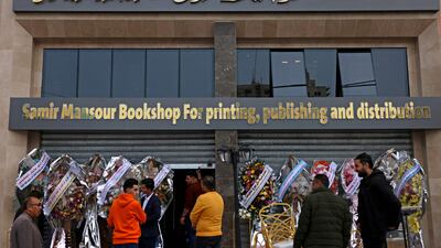 Workers prepare for the opening of the new Samir Mansour bookshop that was destroyed during last year's 11-day war between Israel and the Palestinian Hamas movement, in Gaza City. Mansour's beloved bookshop has been rebuilt and restocked following an international fundraiser.