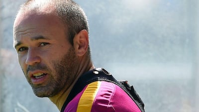 Barcelona’s midfielder Andres Iniesta arrives to a training session at the Sports Centre FC Barcelona Joan Gamper in Sant Joan Despi, near Barcelona on April 16, 2016, on the eve of the final of the Copa del Rey match between FC Barcelona and Sevilla FC. Lluis Gene / AFP