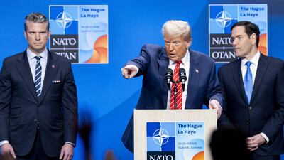 US President Donald Trump talks to the press after the Nato summit in The Hague. EPA