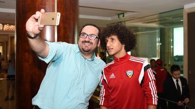 Omar Abdulrahman poses for a selfie with a fan.