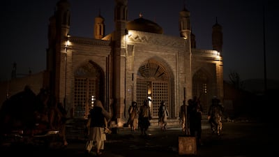 Taliban fighters at the entrance of the Eid Gah Mosque in Kabul after an explosion killed five people on Sunday. Photo: AP