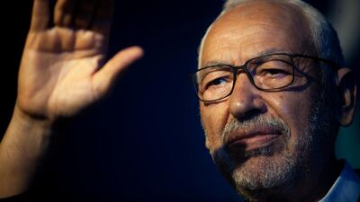 Ennahda parliament speaker Rashid Ghannouchi waves to supporters during a meeting in Tunis in October. AP