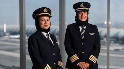Hanan Mohammed Jawad, left, and Bakhita Al Mheiri have become the first Emirati female captains at Emirates. Chris Whiteoak / The National