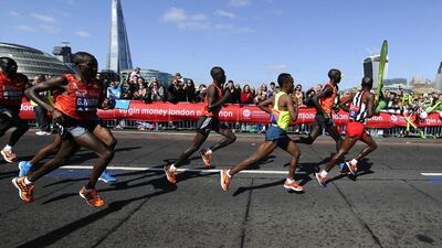 Wilson Kipsang of Kenya, second from right, crosses Tower Bridge before winning the Virgin Money London Marathon on April 13, 2014 in London, England. Alan Crowhurst/Getty Images