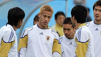 Keisuke Honda, the Japan midfielder, centre, says he wants to keep progressing further and further in South Africa.