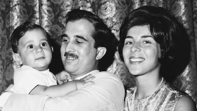 Princess Firyal of Jordan with Prince Muhammed bin Talal holding their son Prince Talal bin Muhammad on his first birthday in 1966. Getty Images