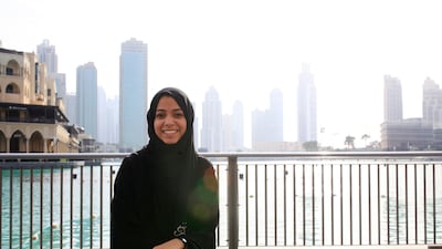 An Emirati university student beside the Dubai Mall Fountain. Sarah Dea / The National