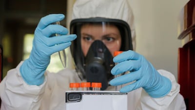 A scientist works inside a Moscow laboratory, testing vaccine against Covid-19. Russian sovereign fund RDIF, which funded the development of the Sputnik V vaccine, says its venture capital unit and Sberbank are launching a joint $100 million fund to invest in technology and science start-ups. Reuters