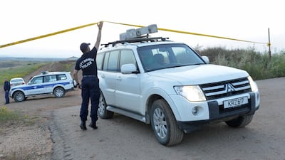 Cypriot police at the area where the body of a woman was discovered near the village of Orounta on April 25, 2019. Reuters