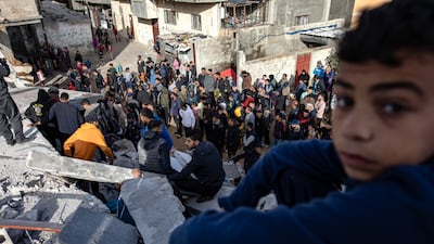 Palestinians search for survivors following an Israeli air strike on the Rafah refugee camp in southern Gaza on March 3. EPA