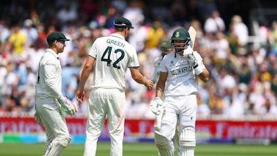 Australia's Cameron Green and Alex Carey shakes hands with Aiden Markram as he walks back to the Lord's pavilion. Reuters