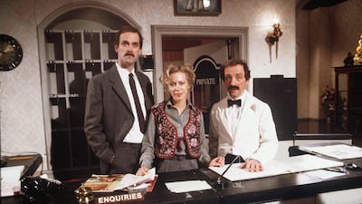 John Cleese, Connie Booth and Andrew Sachs in an episode of 'Fawlty Towers'. Photo by Shutterstock