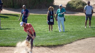 Tommy Fleetwood powers through the bunker on the eighth hole. Victor Besa / The National