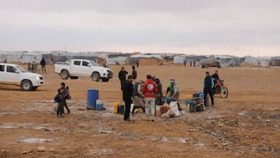 Aid workers of the Syrian Arab Red Crescent deliver aid in the Rukban camp for displaced Syrians in November 2018. SARC