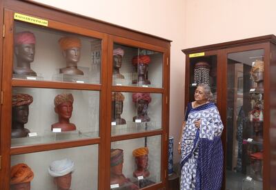 Manda Hingurao, the Headgear Gallery’s curator, explores the exhibition. Photo: Maharaja Fateh Singh Museum
