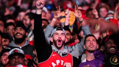 Toronto Raptors fans watch the broadcast of Game 6 of basketball's NBA Finals between the Raptors and the Golden State Warriors, at a viewing party outside Scotiabank Arena. AP Photo