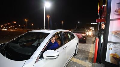 Saudi Samira Al-Ghamdi is seen in her car with family driving at a food court in the coastal city of Jeddah for the first time. Amer Hilabi / AFP