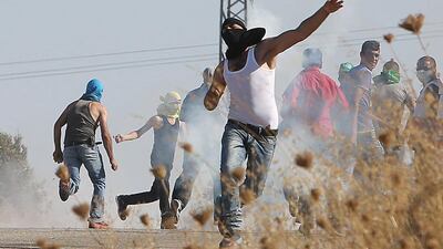 A Palestinian man during clashes with Israeli security forces on August 8 in the West Bank village of Duma, following the funeral Saad Dawabsha, the father of Palestinian toddler Ali who was killed last week when their home was attacked by Jewish extremists. Dawabsha died in hospital in the southern Israeli city of Beersheba where he was being treated for third-degree burns for the past eight days. AFP Photo