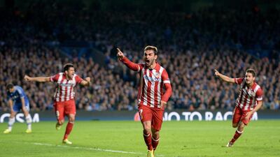 Atletico Madrid's Adrian Lopez, centre, celebrates scoring the equaliser during the Uefa Champions League semi-final second leg against Chelsea at Stamford Bridge in London on April 30, 2014. Andy Rain / EPA