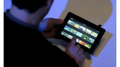 A visitor test-drives the new BlackBerry Playbook at the 3GSM world congress in Barcelona, Spain in February.