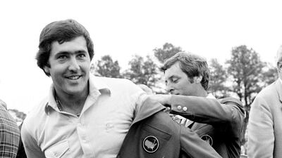 In this April 13, 1980 file photo, Seve Ballesteros of Spain, left, is helped with his Masters green jacket by the previous year's winner, Fuzzy Zoeller, right, after winning the 1980 Masters, in Augusta, Ga. Ballesteros had a 10-shot lead going to the back nine in the 1980 Masters before throwing away shots. His six-shot win was one of the most dominant Masters victories. (AP Photo/file)