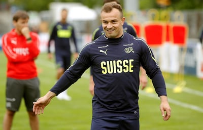 Switzerland player Xherdan Shaqiri smiles during a training session. Arnd Wiegmann / Reuters