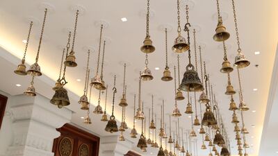 More than 100 brass bells at the entrance of the prayer hall