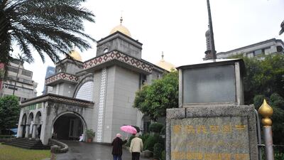 People walk into a mosque in Taipei. Mandy Cheng / AFP