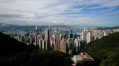 Victoria Harbour and downtown skyline is seen from the Peak District in Hong Kong where a four-bed home has sold for more than Dh500m. Bobby Yip/Reuters