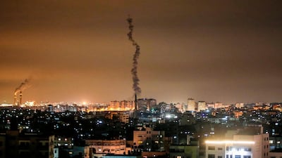 The smoke trail of a rocket, fired by Palestinian militants, flying over the Gaza Strip. AFP
