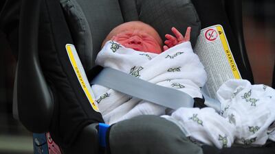 Prince William and Catherine, Duchess of Cambridge' new-born baby boy seen in a car seat outside the Lindo Wing of St Mary's Hospital. AFP PHOTO / CARL COURT