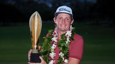 Cameron Smith of Australia celebrates with the winner's trophy after the final round of the Sony Open in Hawaii. AFP