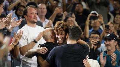 Jannik Sinner celebrates with his team. EPA