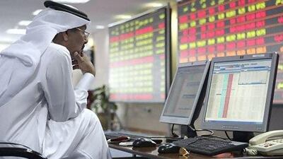 An investor monitors stock market activities at the Doha securities market. Reuters