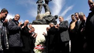 Lebanese anti-Syrian legislators lay a wreath at Martyrs Square statue in Beirut.
