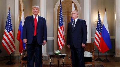 Donald Trump and Vladimir Putin stand aside one another in Helsinki. Reuters