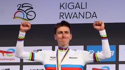 Slovenia's Tadej Pogacar celebrates on the podium after winning the men's road race in Rwanda. Reuters