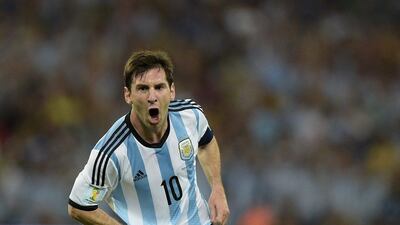 Lionel Messi scores after scoring his team's second goal, the eventual winner, against Bosnia on Sunday night in Argentina's 2-1 win at the 2014 World Cup at the Maracana in Rio de Janeiro, Brazil. Juan Mabromata / AFP / June 15, 2014