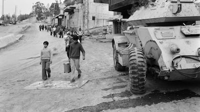 Students leave the Lebanese village of Kahaleh on April 3, 1976, the day after a 10-day truce began. This followed a blockade imposed by Palestinian and Lebanese left-wing fighters on the Christian stronghold in Mount Lebanon.